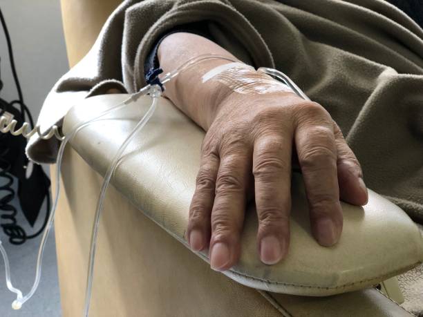 Patient’s hand resting on an armrest during an infusion